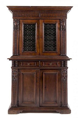 An Italian Renaissance Style Walnut Cabinet Height 79 1/2 x width 48 1/2 x depth 19 7/8 inches.