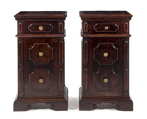 A Pair of Italian Renaissance Style Walnut Side Cabinets Height 39 1/4 x width 22 x depth 13 3/4 inches.