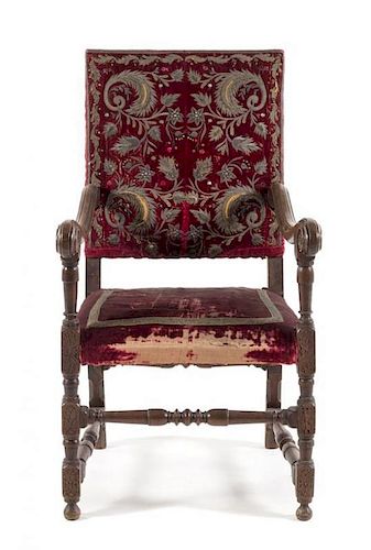 * A Spanish Baroque Walnut Armchair Height 43 1/4 inches.
