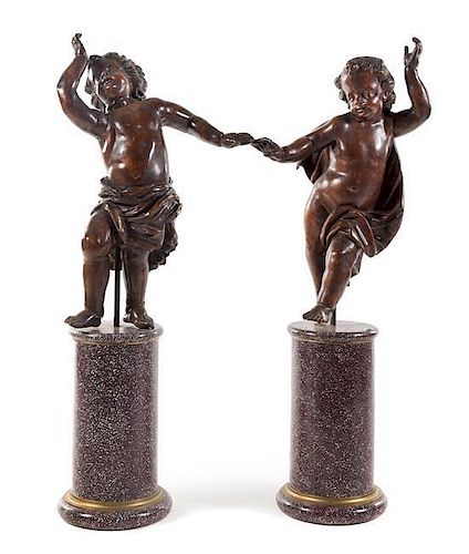 A Pair of Italian Carved Oak Figures Height of taller 54 1/4 inches.