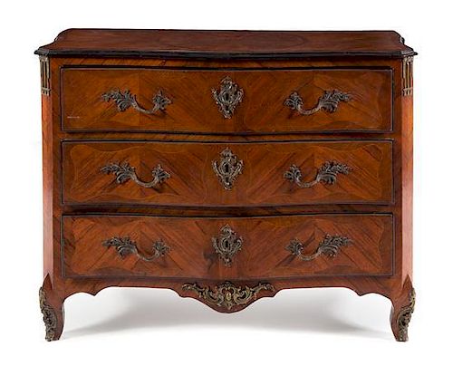 A Regence Style Bronze Mounted Rosewood Commode Height 39 1/4 x width 51 x depth 25 1/4 inches.