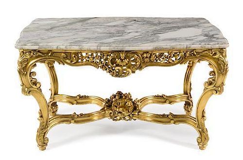 A Louis XV Style Giltwood Center Table Height 28 1/2 x width 52 1/2 x depth 33 inches.