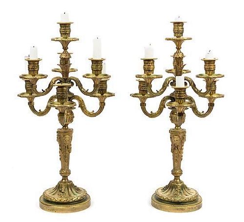 * A Pair of Louis XVI Style Gilt Bronze Seven-Light Candelabra Height 20 3/4 inches.