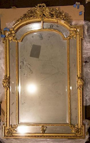 A Louis XVI Style Giltwood Pier Mirror Height 68 x width 40 1/2 inches.