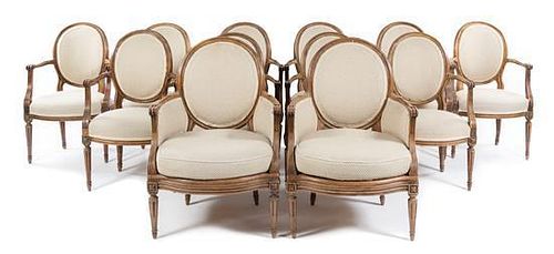 * A Set of Twelve Louis XVI Style Dining Chairs Height of tallest 38 1/2 inches.