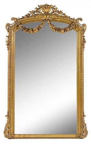 A Napoleon III Giltwood Overmantel Mirror Height 82 1/2 x width 51 inches.