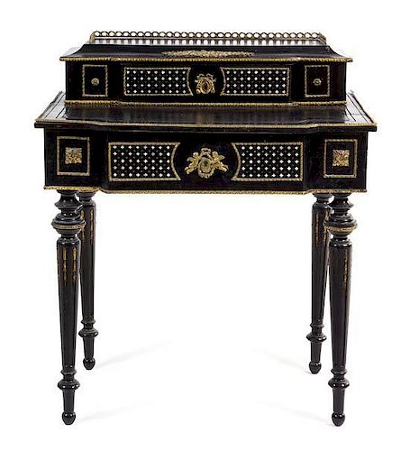 A Napoleon III Mother-of-Pearl Inlaid Ebonized Desk Height 36 1/4 x width 30 3/4 x depth 21 inches.