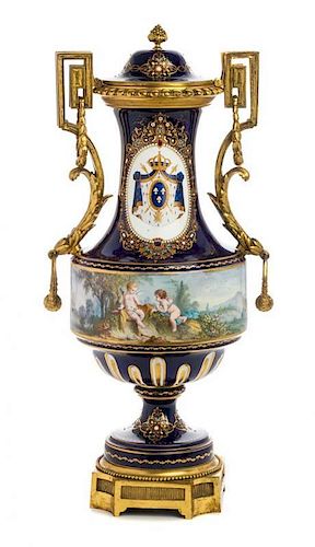 A Gilt Bronze Mounted Sevres Style Jeweled Porcelain Covered Urn Height 24 inches.