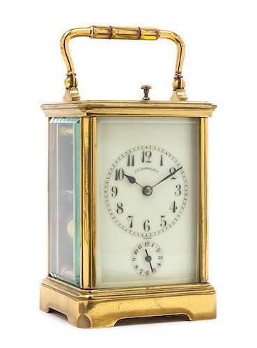 A French Gilt Brass Carriage Alarm Clock Height 6 3/4 inches.