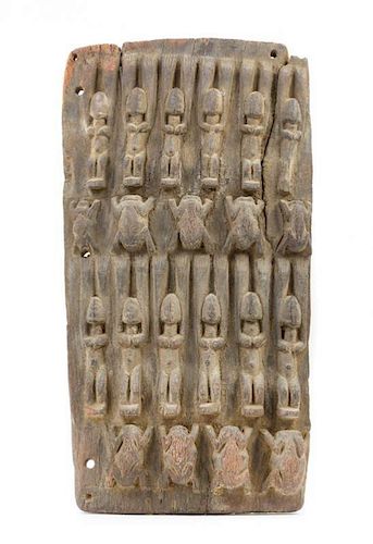 * A Dogon Wood Granary Door Height 21 x width 11 1/8 inches.