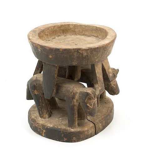* A Yoruba Ifa Wood Divination Bowl Height 8 inches.