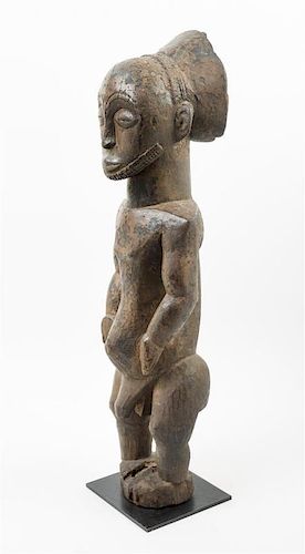 * A Hemba Wood Figure Height 27 1/2 inches.