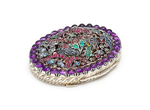 A Continental Silver and Gemstone Compact, 20th Century, of oval form, the pierced lid set with both natural and faux amethys