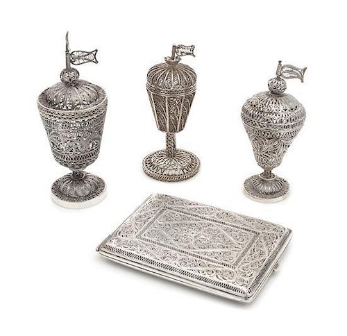 * A Group of Four Middle Eastern Silver Filigree Objects, , comprising three spice towers and a cigarette case.