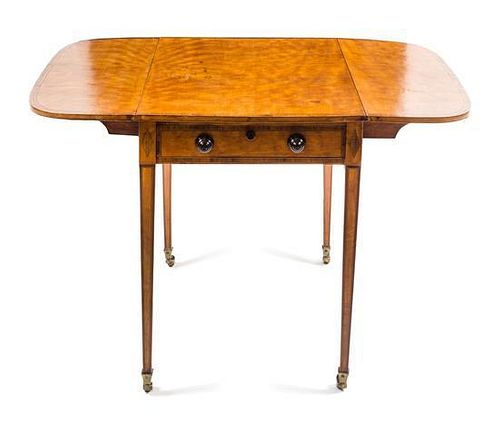 A George III Satinwood Pembroke Table Height 27 1/2 x width 45 1/2 x depth 36 inches.