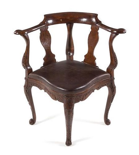 A Georgian Style Oak Corner Chair Height 31 1/2 x width 19 1/2 x depth 19 1/2 inches.