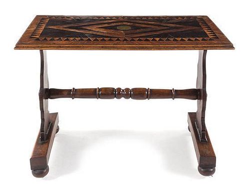 An English Parquetry Shipwreck Table Height 29 1/2 x width 43 x depth 22 1/2 inches.