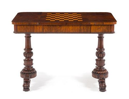 A Regency Rosewood Game Table Height 28 1/2 x width 42 x depth 20 3/4 inches.