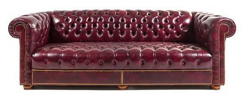 A Faux Leather Upholstered Chesterfield Sofa Height 29 x width 90 x depth 34 inches.