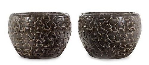 A Pair of Celtic Style Carved Stone Jardinieres Height 16 1/2 x diameter 23 inches.