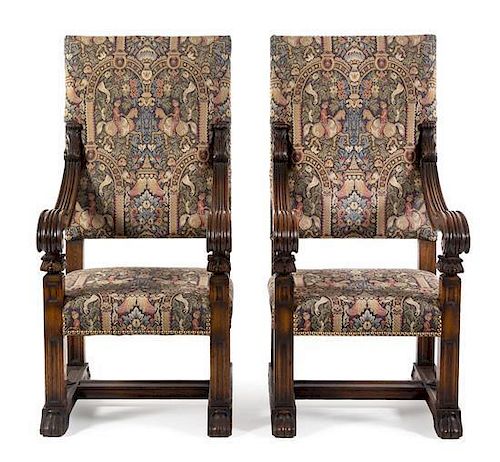 A Pair of Oak Renaissance Revival Open Arm Chairs Height 55 1/4 x width 26 1/2 x depth 28 1/2 inches.