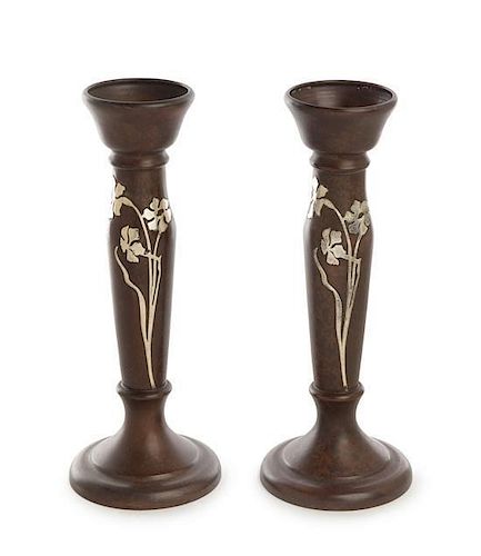 * A Pair of American Art Nouveau Silver Inlaid Bronze Candlesticks, Heintz Art Metal Shop, Buffalo, NY, the bronze stem of ba
