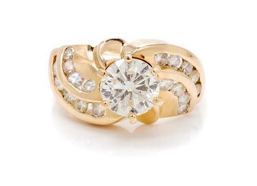 * A 14 Karat Yellow Gold Clarity Enhanced Diamond and Diamond Ring,containing one fracture filled round brilliant cut diamon