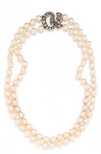 A Silver Topped Gold, Diamond and Cultured Pearl Double Strand Necklace, 48.75 dwts.