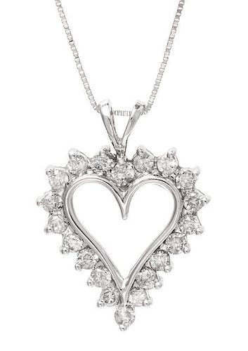 * A 14 Karat White Gold and Diamond Heart Pendant, 3.60 dwts.