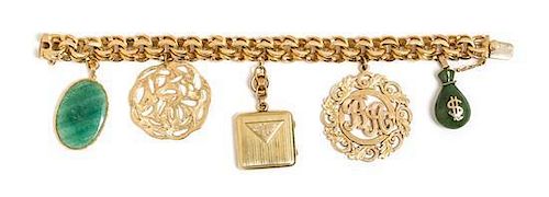 * A 14 Karat Yellow Gold Bracelet with Five Attached Charms, 60.10 dwts.