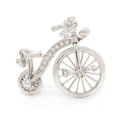 A 14 Karat White Gold and Diamond Articulated Bicycle Brooch, 4.40 dwts.