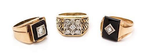 A Collection of Yellow Gold, Onyx and Diamond Rings, 24.30 dwts.