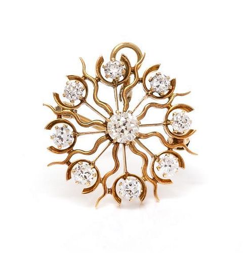 A Yellow Gold and Diamond Snowflake Pendant/Brooch, 3.30 dwts.
