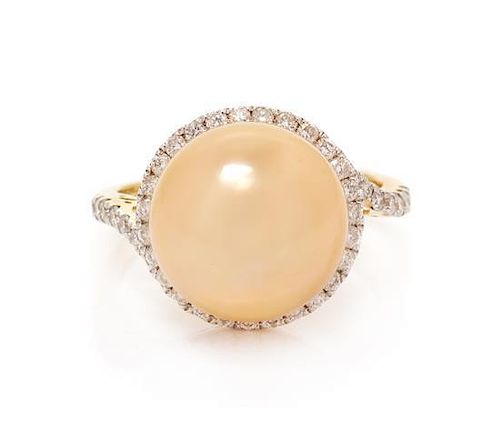 * A 14 Karat Yellow Gold, Cultured Golden South Sea Pearl and Diamond Ring, 3.90 dwts.