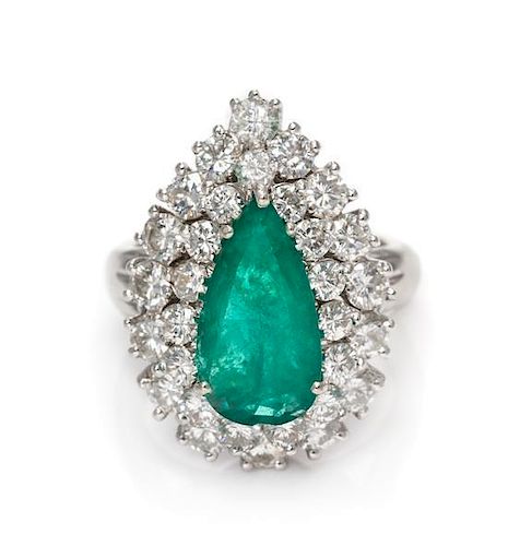 * A 14 Karat White Gold, Emerald and Diamond Ring, 5.40 dwts.