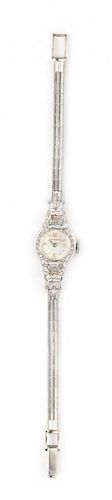 * A 14 Karat White Gold and Diamond Wristwatch, Moncare, 9.60 dwts.