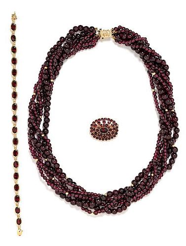 * A Collection of 14 Karat Yellow Gold and Garnet Jewelry, 93.95 dwts.