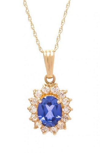 A 14 Karat Yellow Gold, Sapphire and Diamond Pendant, 1.50 dwts.