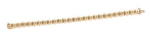 * A 14 Karat Yellow Gold and Diamond Bracelet, 13.25 dwts.