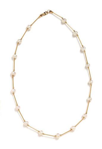 * A 14 Karat Yellow Gold and Cultured Pearl Station Necklace, 4.50 dwts.