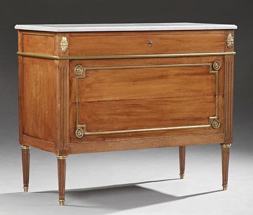 Louis XVI Style Ormolu Mounted Carved Mahogany Marble Top Commode, 20th c., the stepped edge figured white marble over a frie