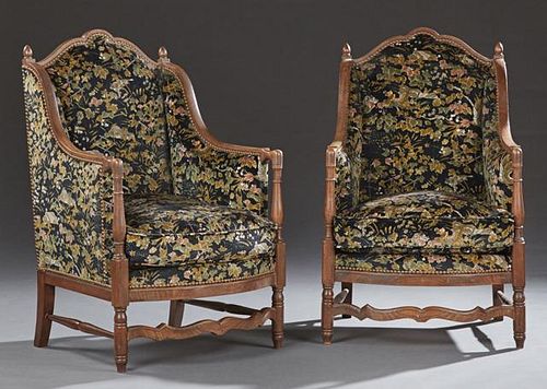 Pair of Upholstered Walnut Diminutive Wing Armchairs, c. 1880, the serpentine arched crest rail flanked by finials above a bo