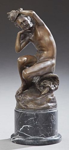 Patinated Bronze Sea Nymph, 20th c., with a conch shell hat, on a circular stepped highly figured black marble base, H.- 15 3