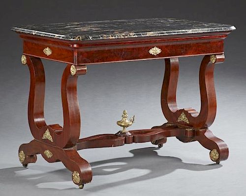 American Federal Carved Mahogany Ormolu Mounted Marble Top Library Table, early 19th c., the highly figured rounded edge blac