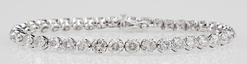 14K White Gold Tennis Bracelet, each of the 40 links mounted with a round diamond, total diamond weight- 8.12 cts., L.- 7 3/8