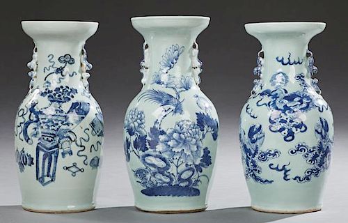 Group of Three Chinese Blue and White Baluster Vases, late 19th c., with applied foo dog handles, one with dragon decoration;