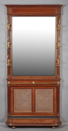 French Carved Mahogany Hall Stand, 19th c., the stepped crown over a wide beveled mirror flanked by reeded stiles with six br