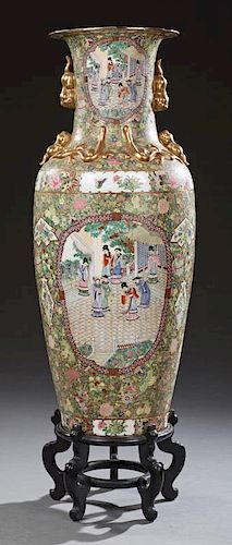Large Oriental Famille Rose Baluster Palace Vase, 20th c., the sides with gilt Foo dog handles above panel decorations of fig