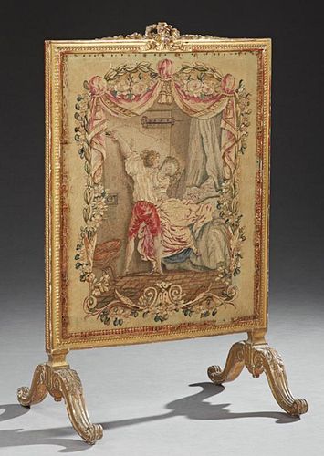 French Louis XVI Style Giltwood Fire Screen, 19th c., the pierced bow carved crest over a relief carved frame around an Aubus