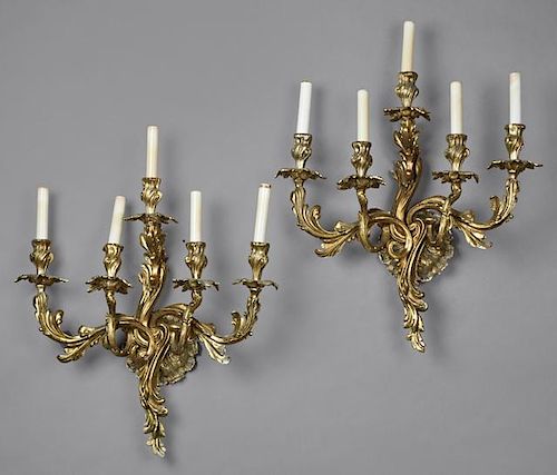 Pair of Louis XV Style Gilt Bronze Five Light Sconces, 20th c., with relief circular back plates issuing swirled leaf form ar